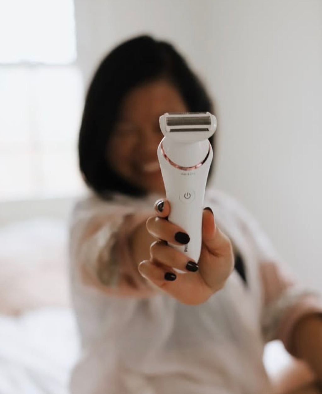 Women Shaving Digital Shaver